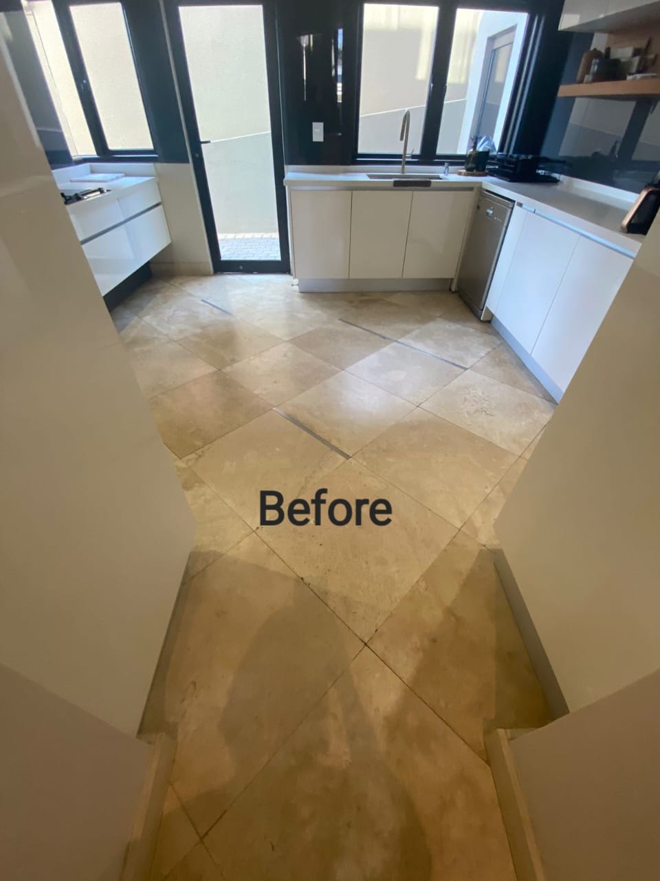 Kitchen natural stone floor before restoration